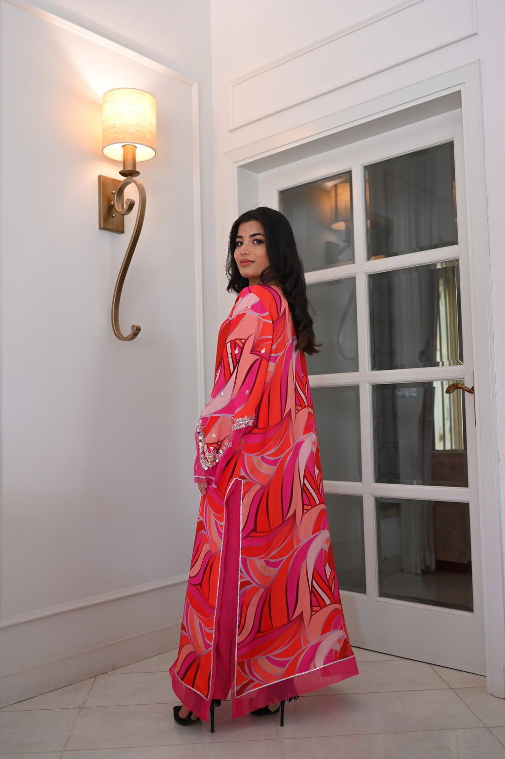 Vibrant Pink-Red Abstract Swirl Maxi Kaftan Dress | Sequin Bell Sleeves, Fringe Hem, Sheer Accents | Bold Pakistani Fusion Evening Abaya Gown
