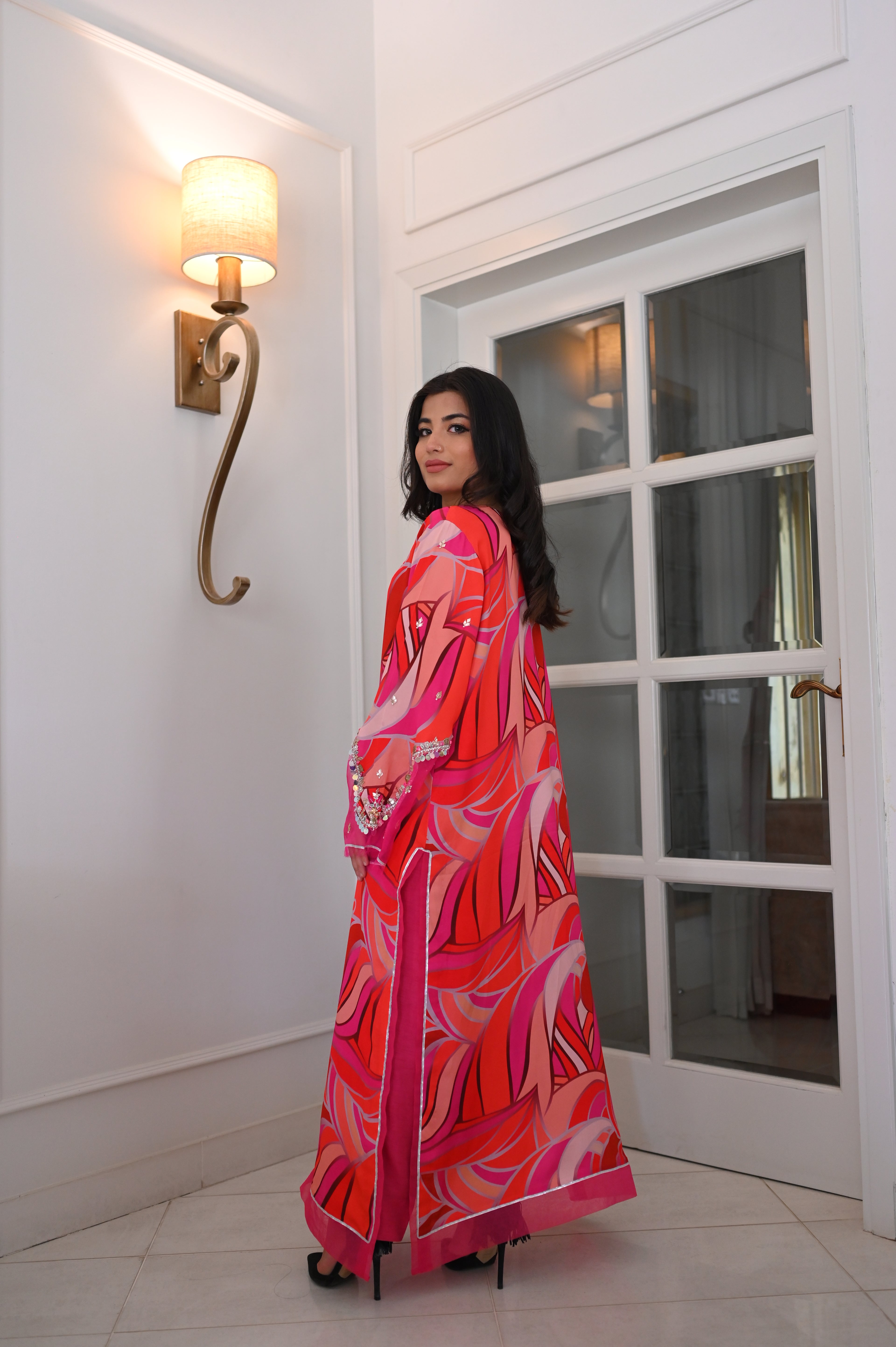 Vibrant Pink-Red Abstract Swirl Maxi Kaftan Dress | Sequin Bell Sleeves, Fringe Hem, Sheer Accents | Bold Pakistani Fusion Evening Abaya Gown