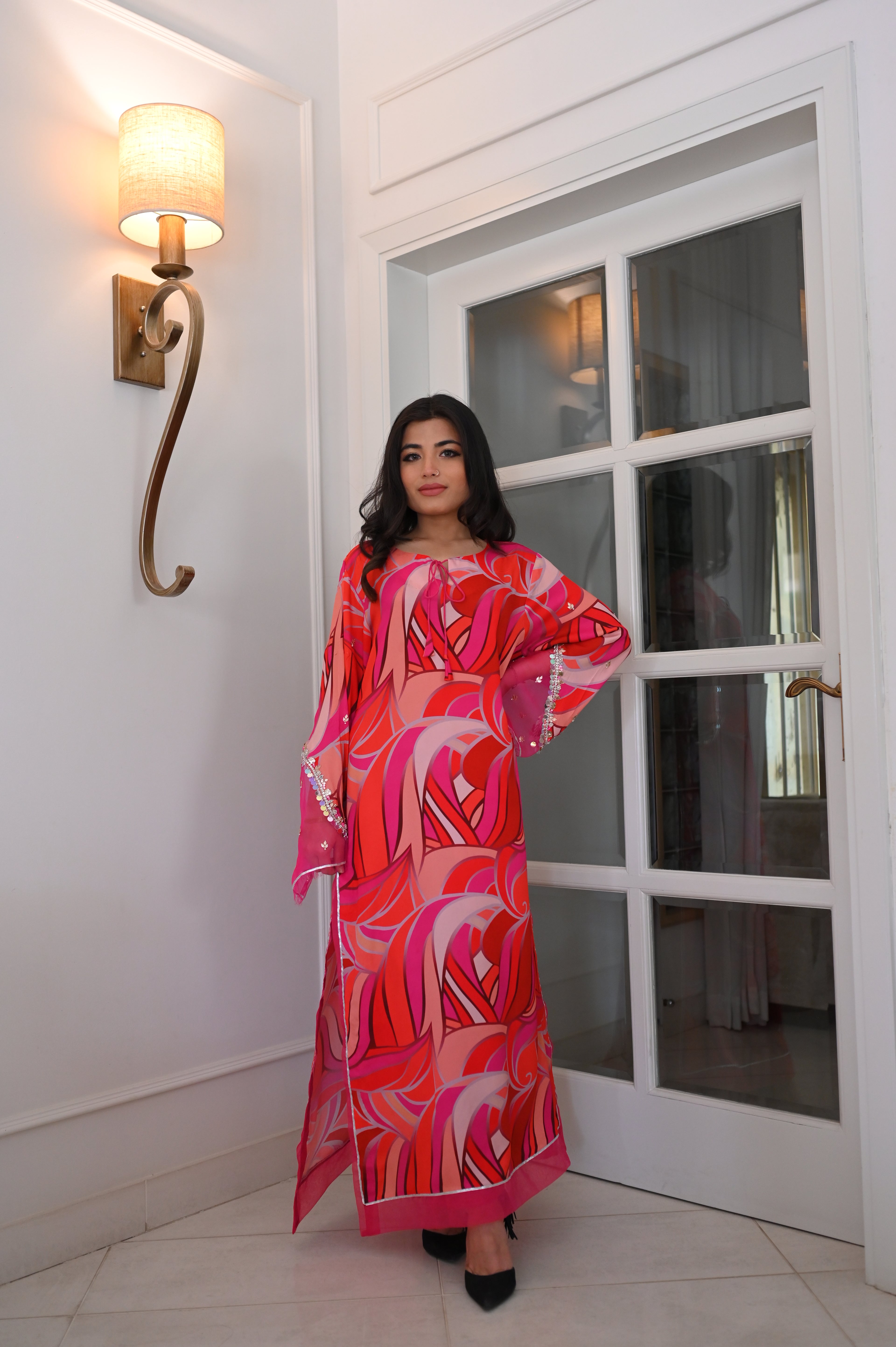Vibrant Pink-Red Abstract Swirl Maxi Kaftan Dress | Sequin Bell Sleeves, Fringe Hem, Sheer Accents | Bold Pakistani Fusion Evening Abaya Gown